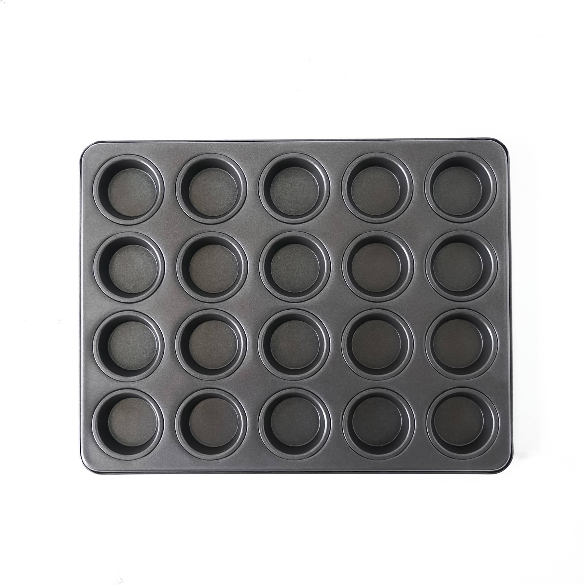 Black muffin tin with multiple compartments on a white background