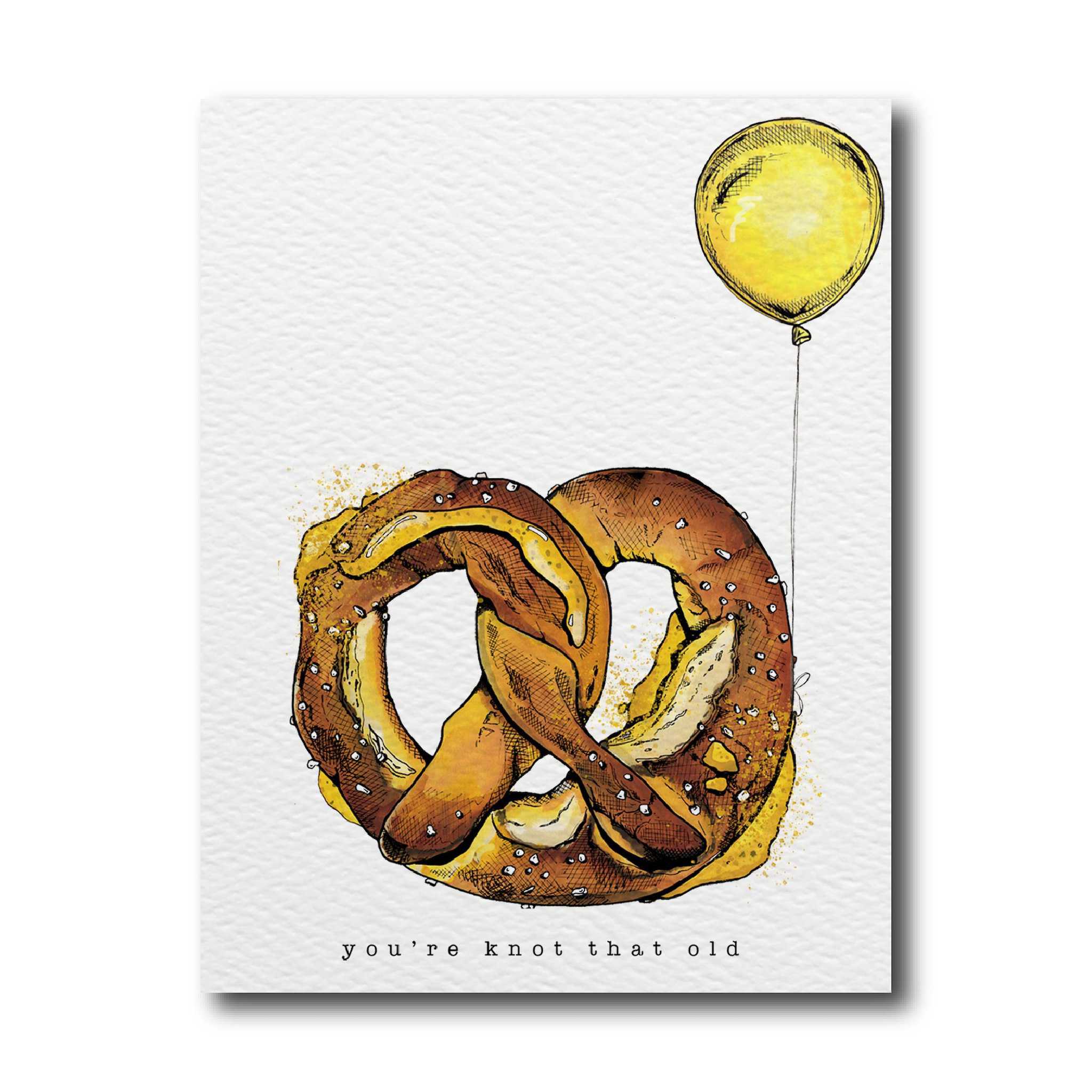 A greeting card with an illustration of a pretzel with a balloon, and the text &