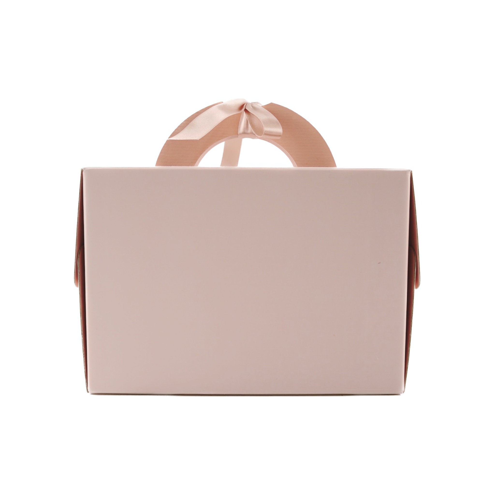 A light pink gift box with a handle and a pink ribbon. The box is empty and ready to be filled with a gift.
