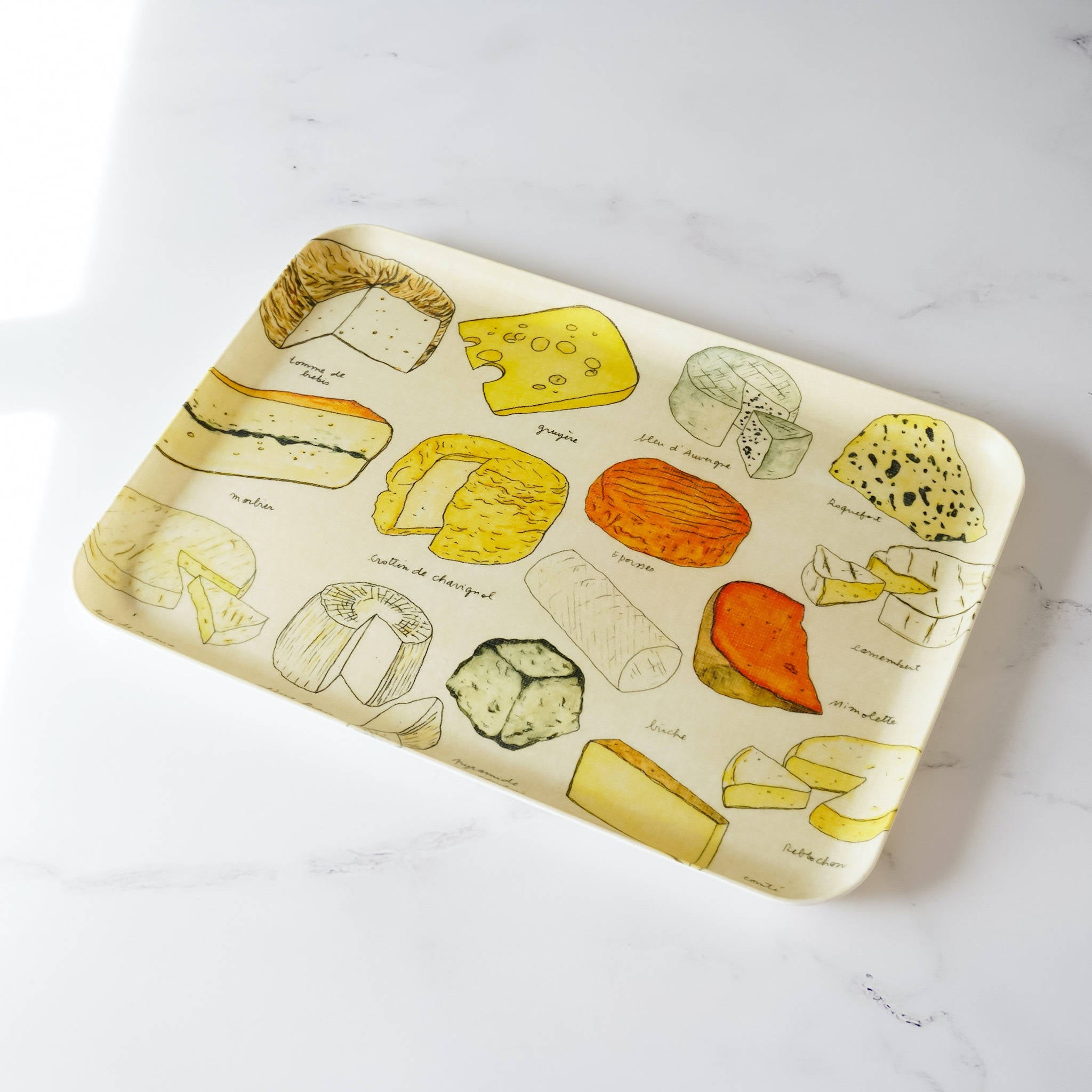 A medium-sized linen serving tray with a colorful cheese-themed pattern, featuring illustrations of different cheeses.