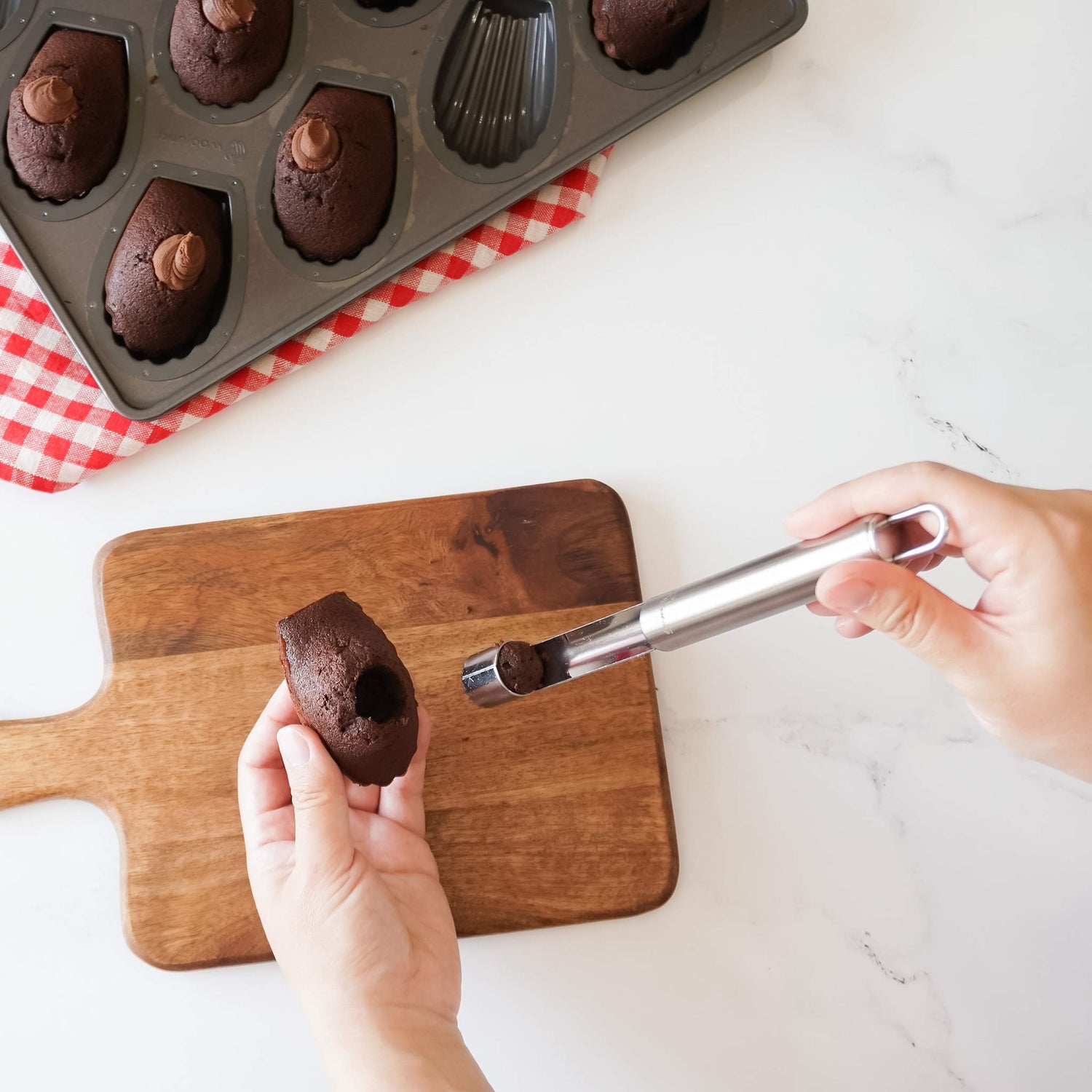Madeleine with a cupcake corer