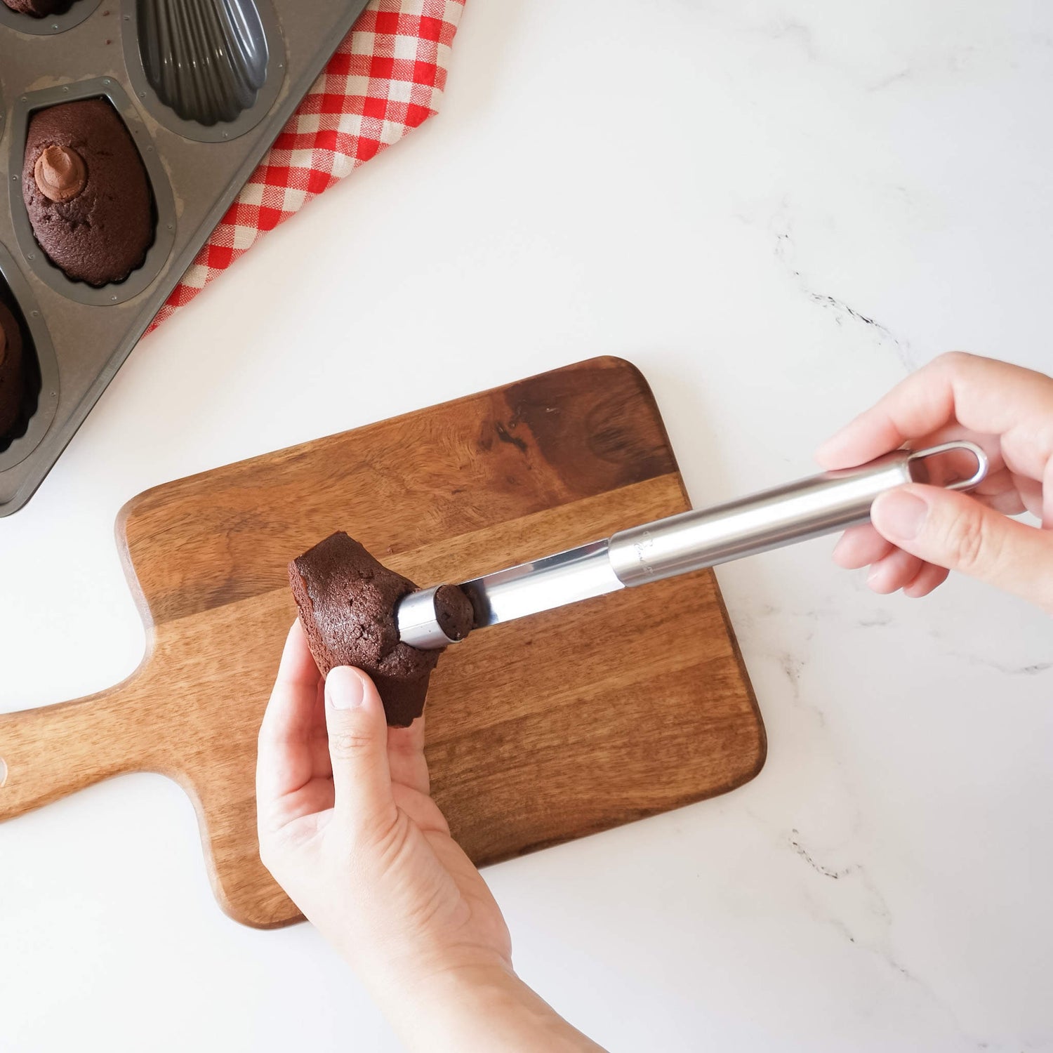 Madeleine with a cupcake corer