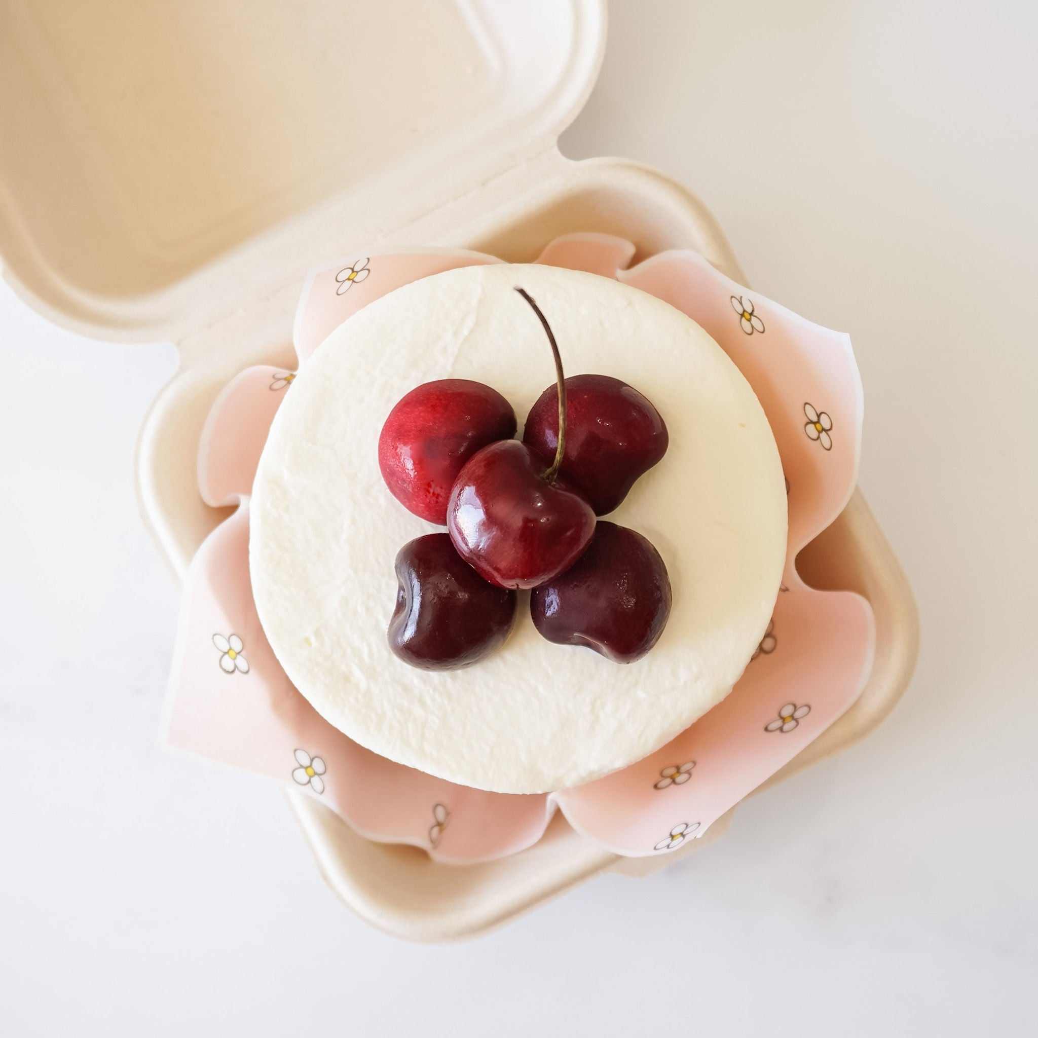 black forest cake, pink daisy parchment paper