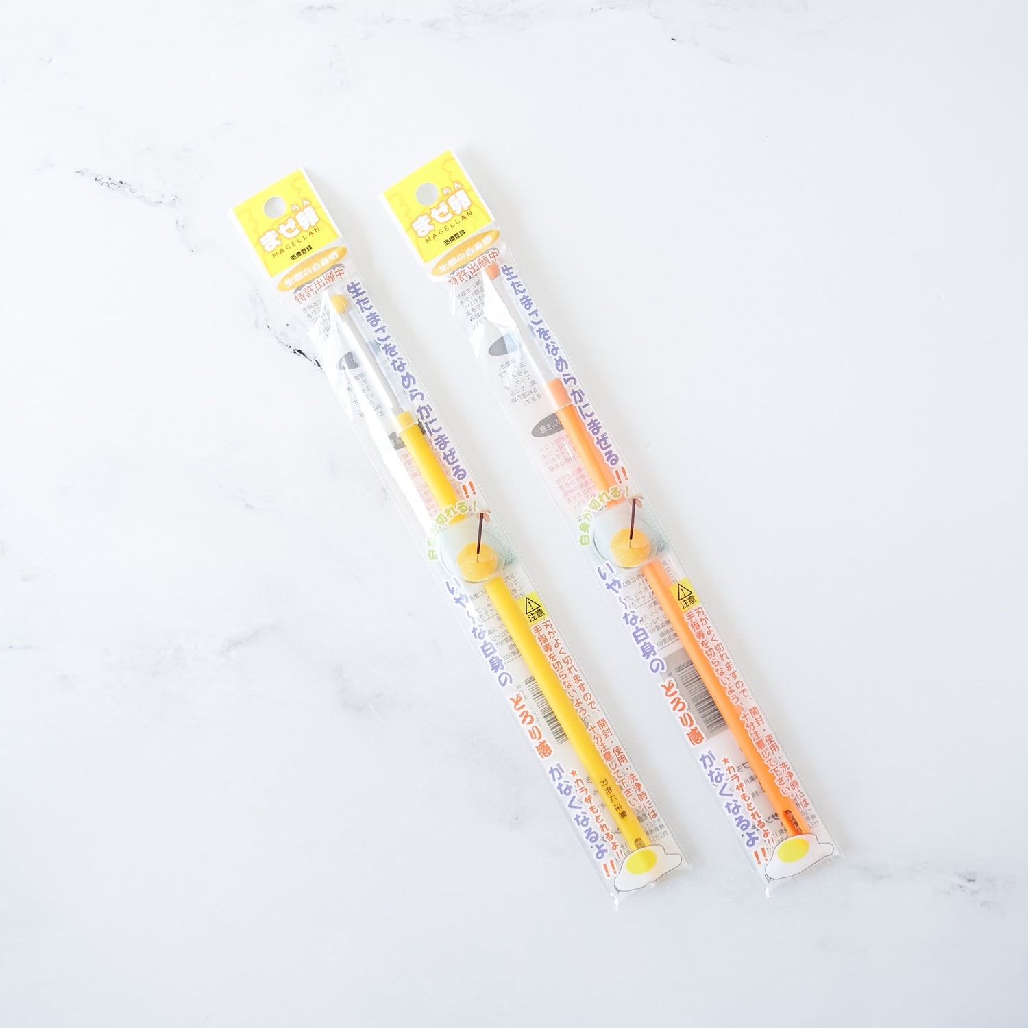egg mixing stick in orange and yellow