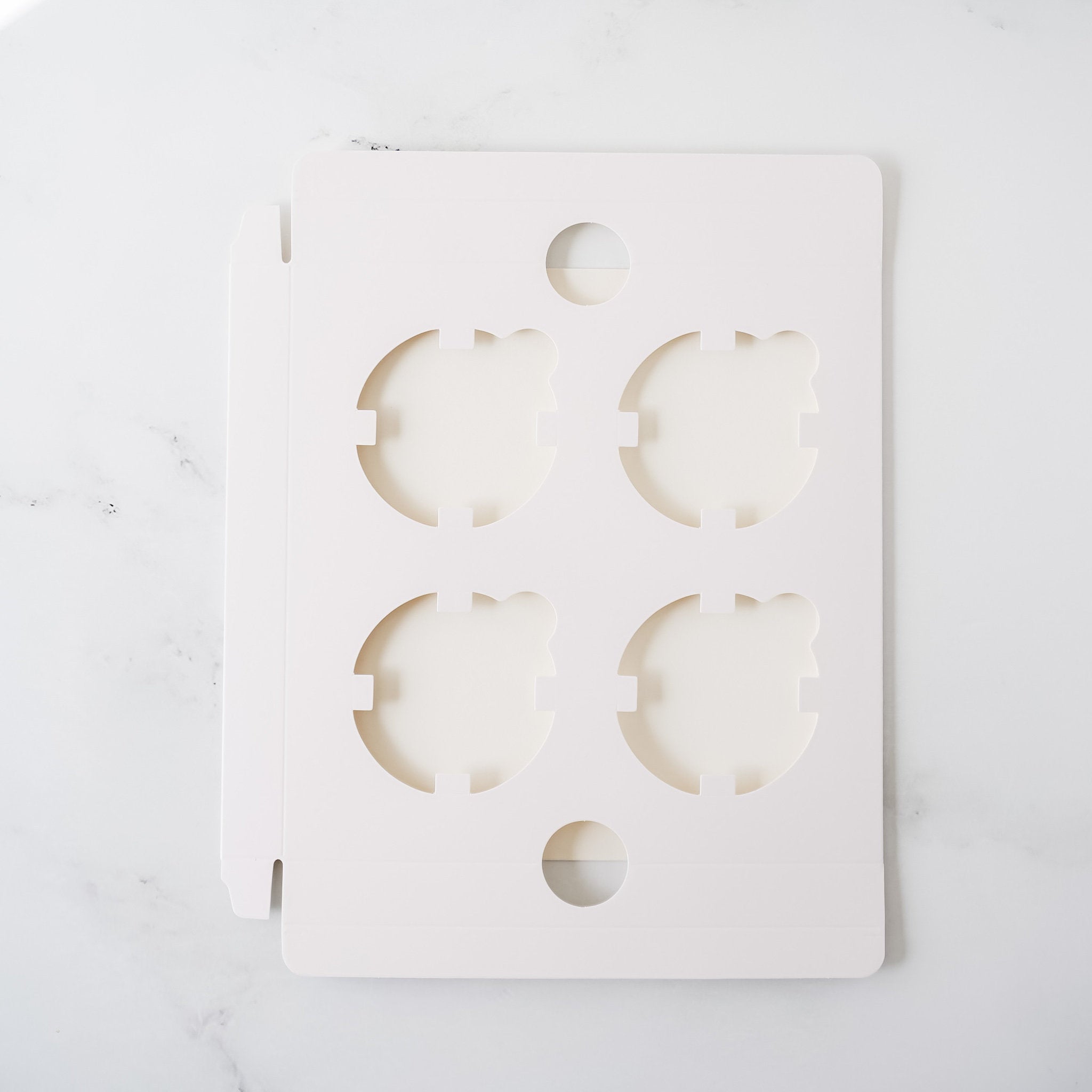 four large cupcake inserts