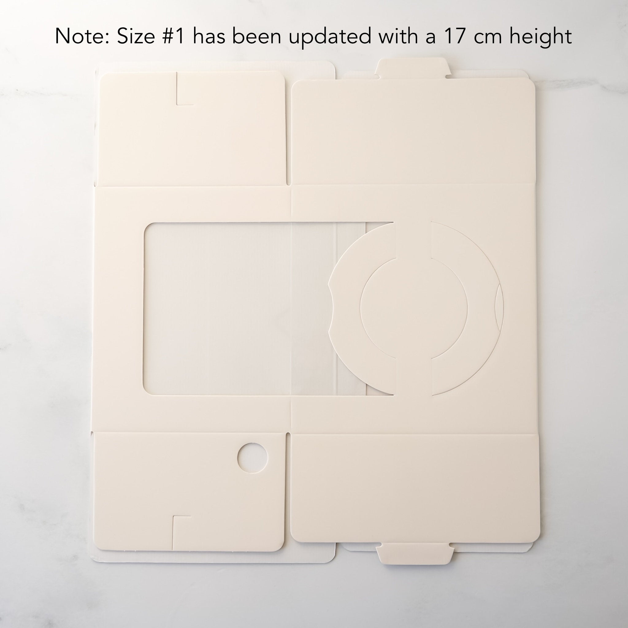 Ivory cake box with a clear window on a white background