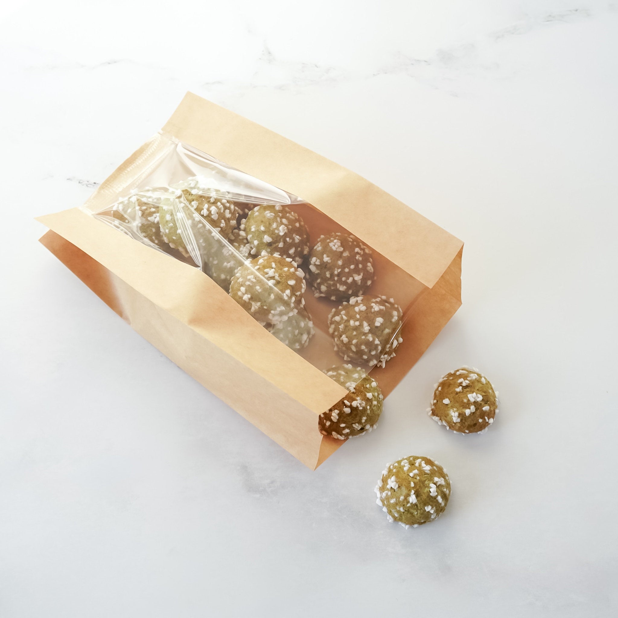 Bag of baked goods with a clear window on a white background