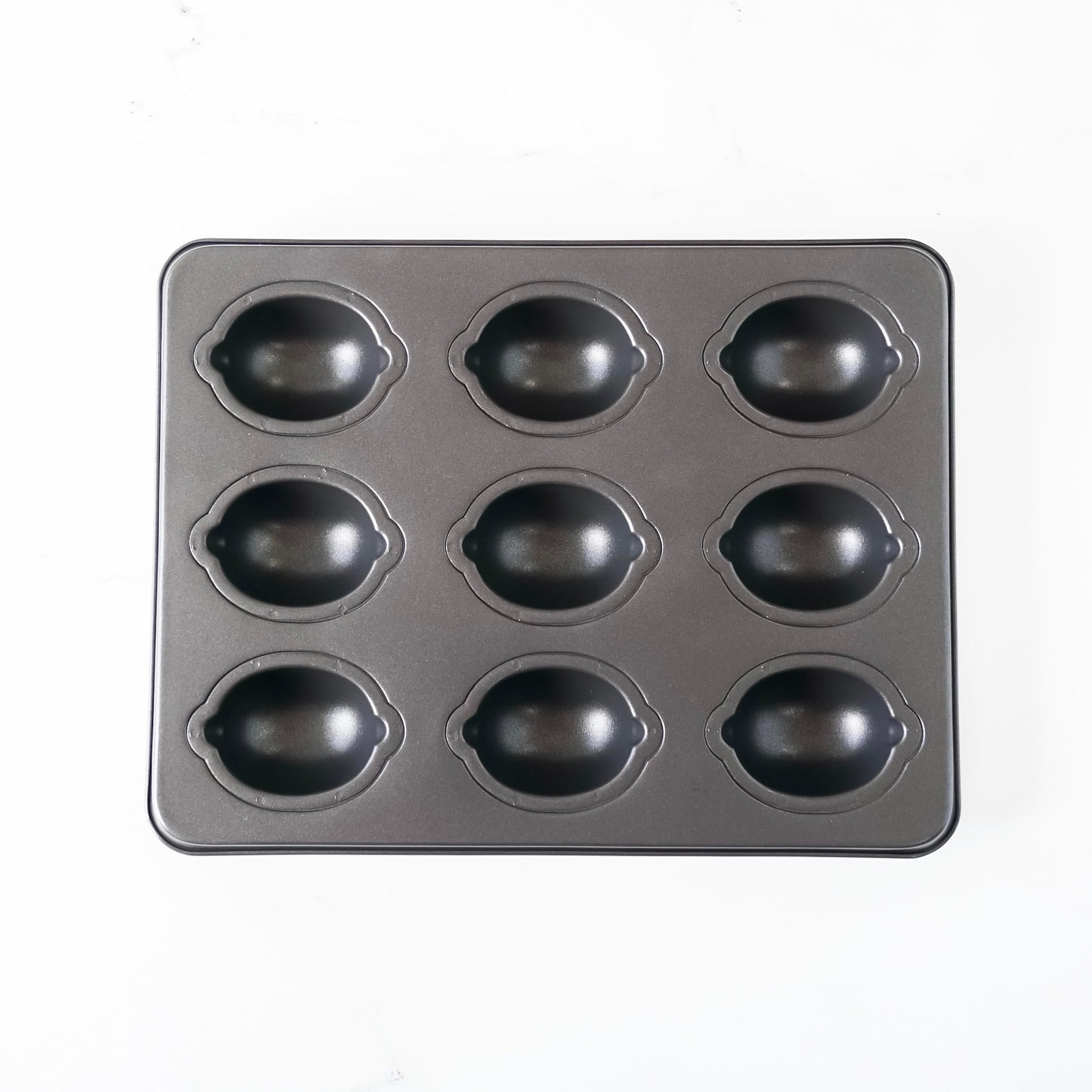 A black Lemon Cake Pan with nine cavities.
