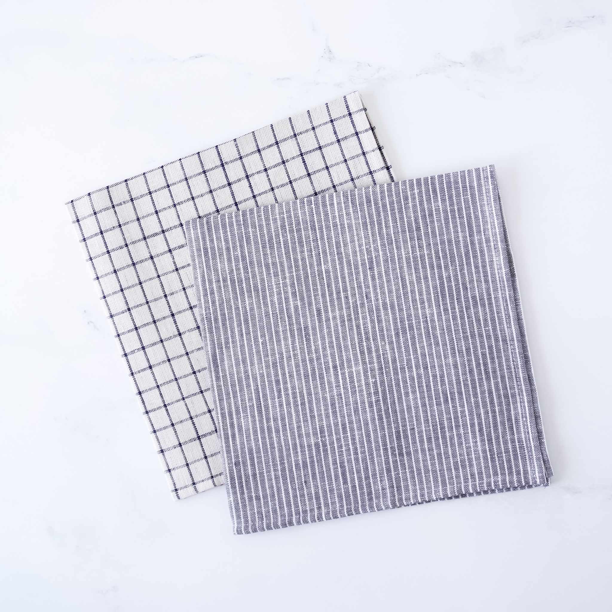 Two checkered linen napkins on a white background