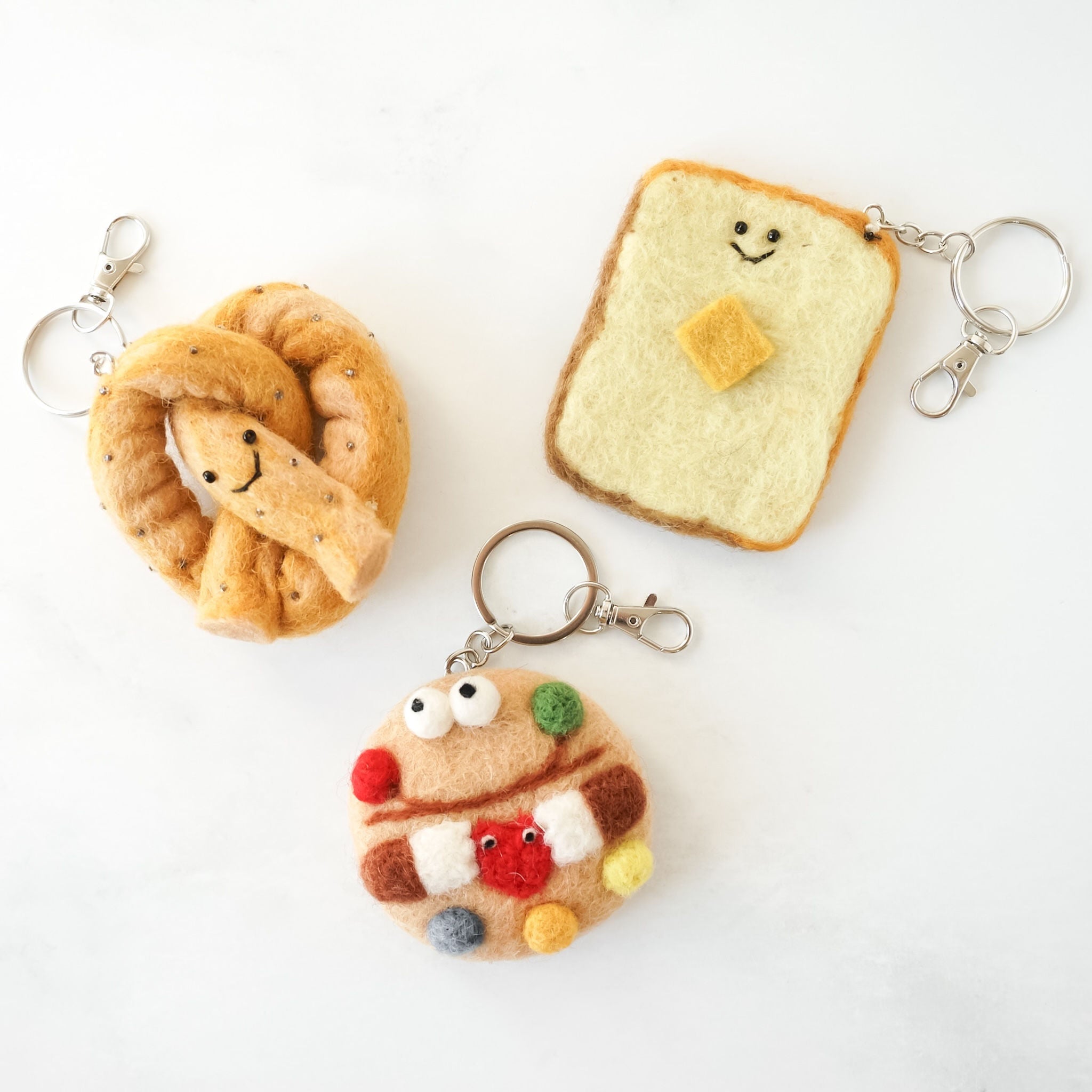 Chocolate candy cookie, butter toast, and pretzel shaped felt key rings