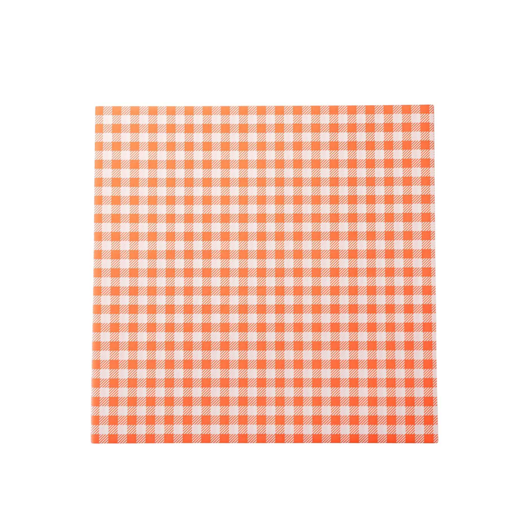 Orange and white checkered deli paper on a white background