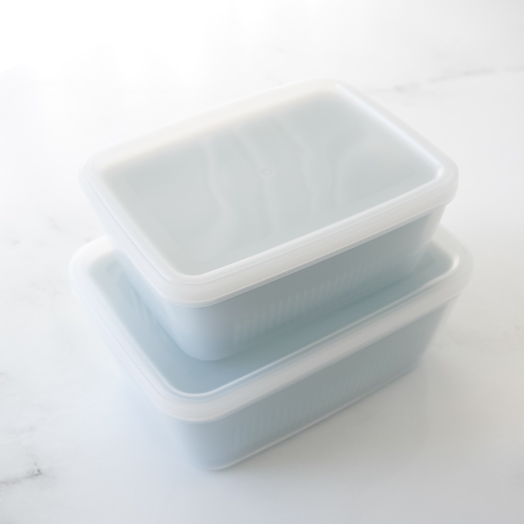 plastic container with strainer and lid in blue
