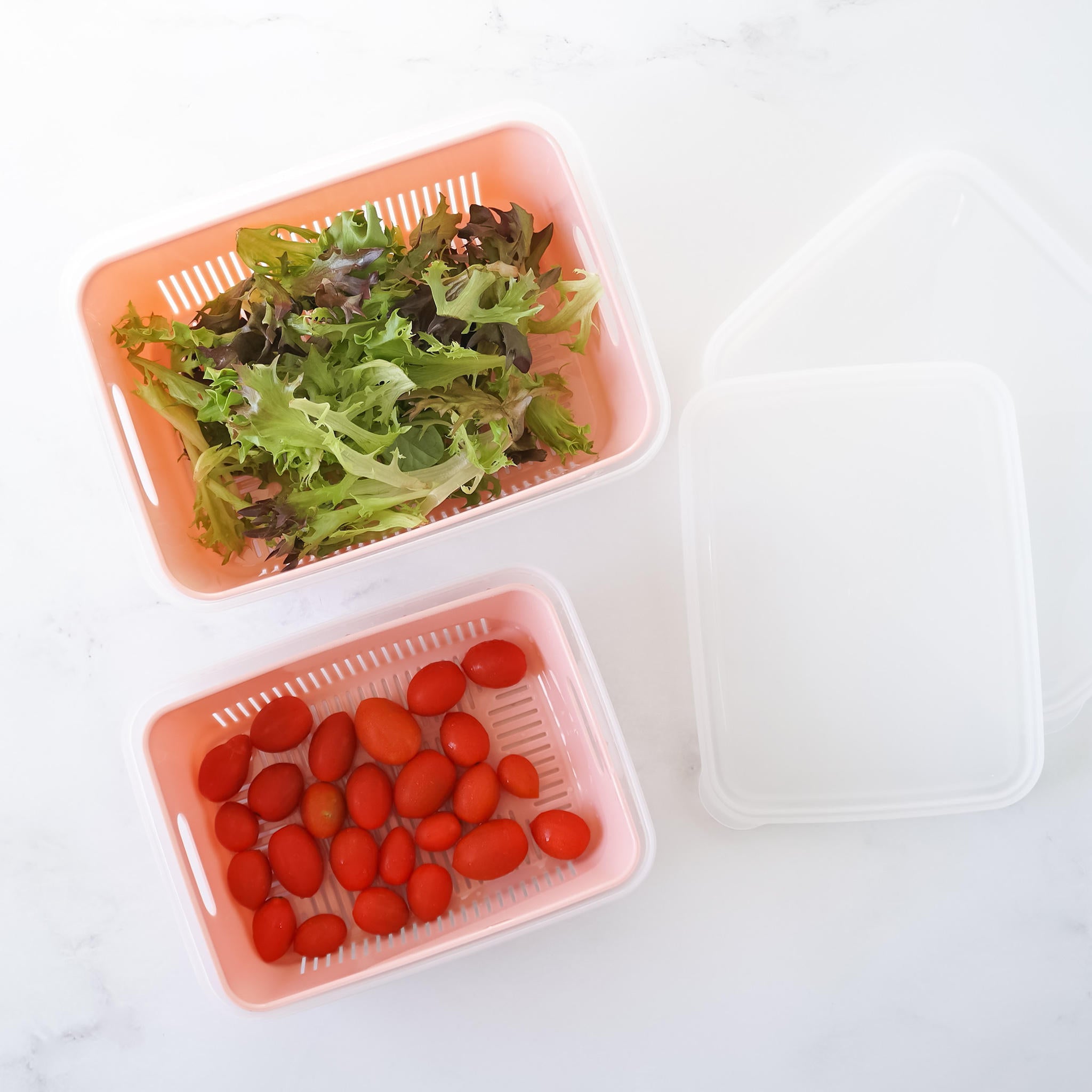 plastic container with strainer and lid in pink