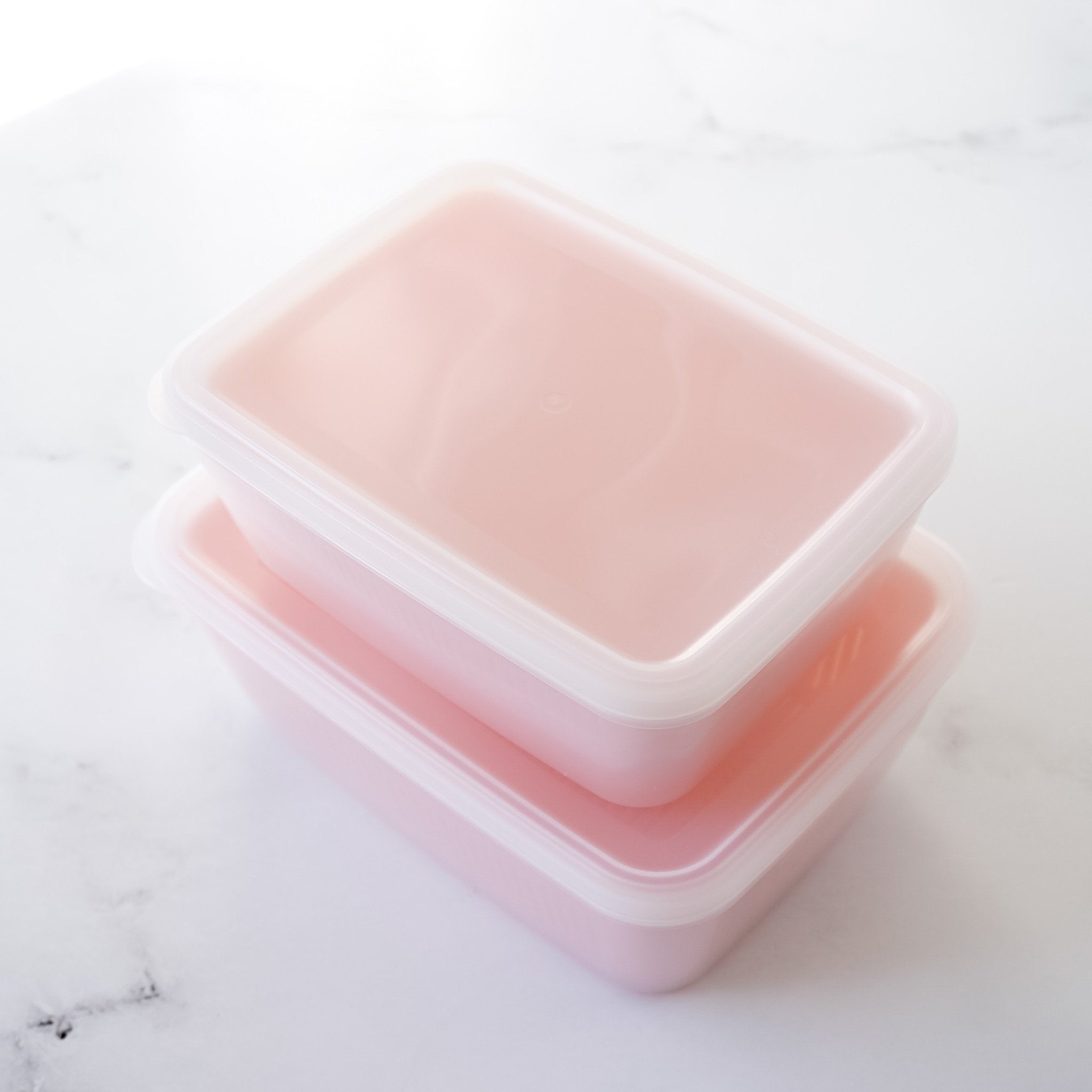 plastic fruit and vegetable container with strainer and lid in pink