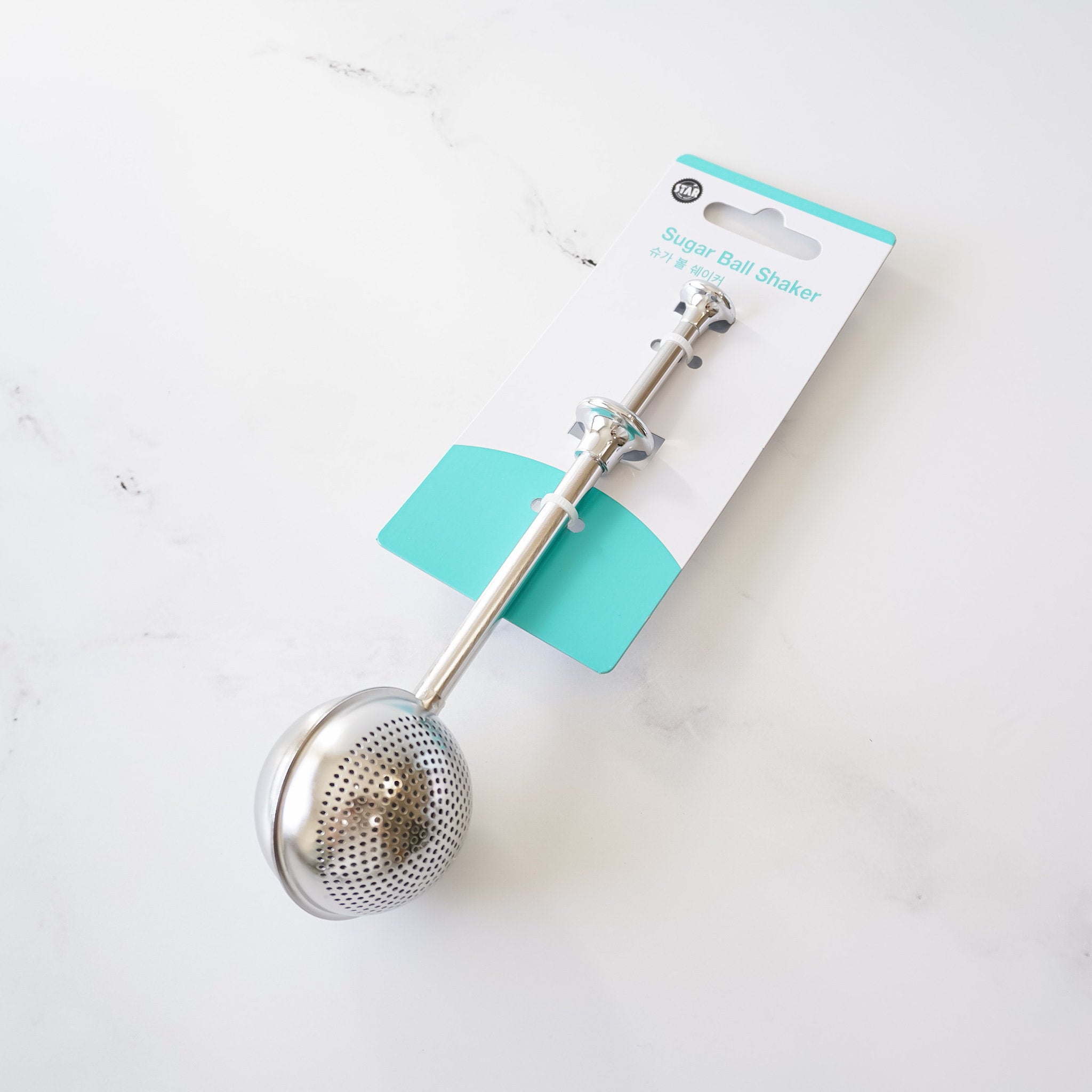 A powdered sugar shaker made of stainless steel, shown with a perforated section for dusting powdered sugar and a solid section for scooping sugar or flour.