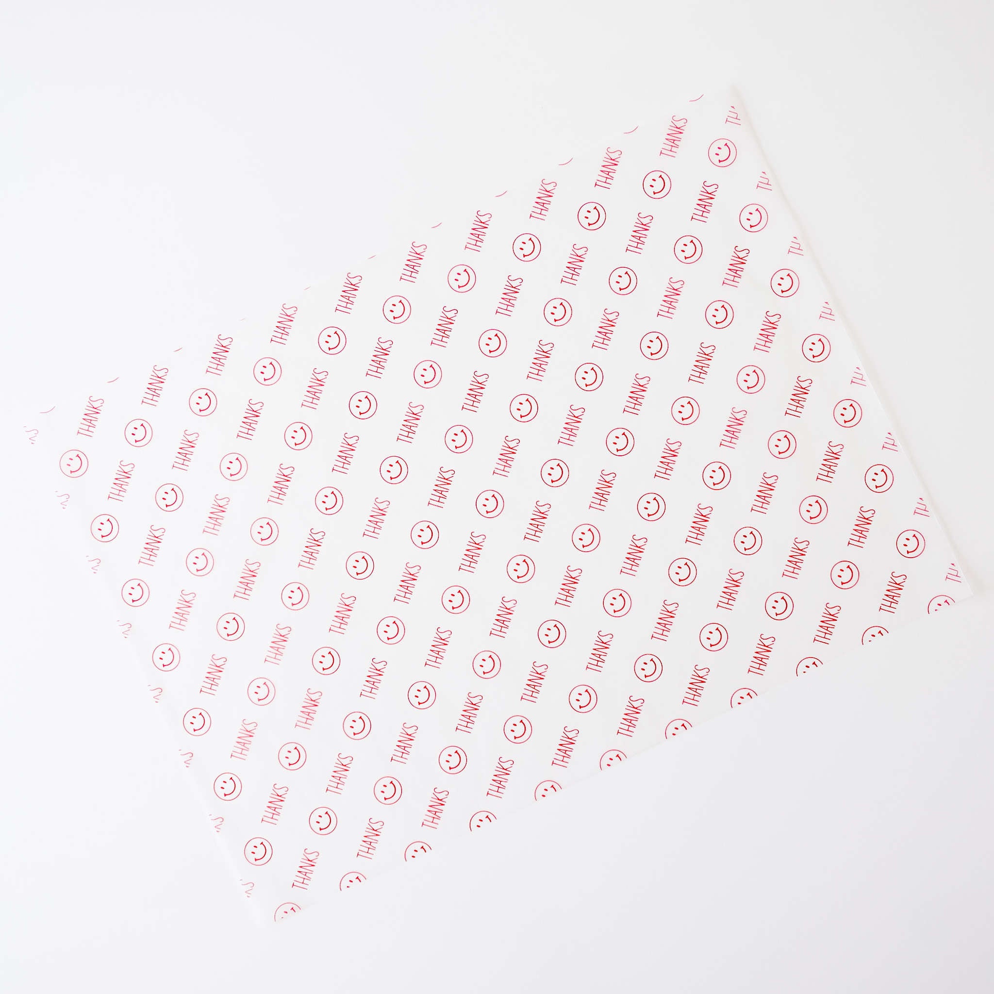 Semi-sheer deli paper with a red &
