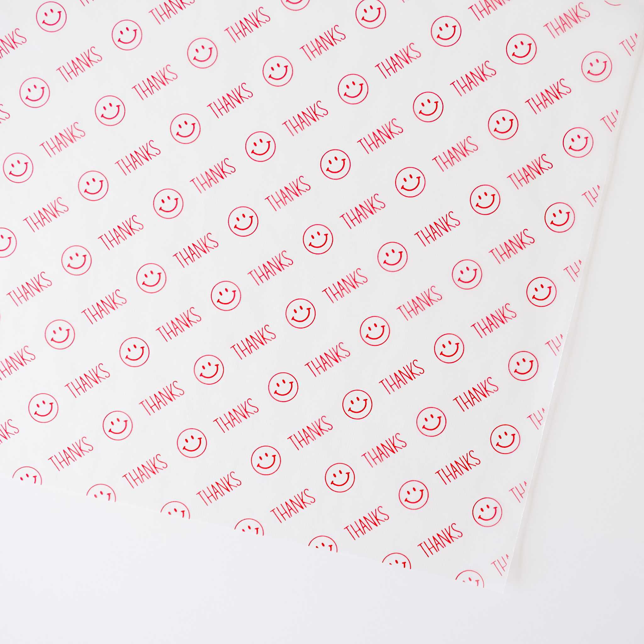 Semi-sheer deli paper with a red &