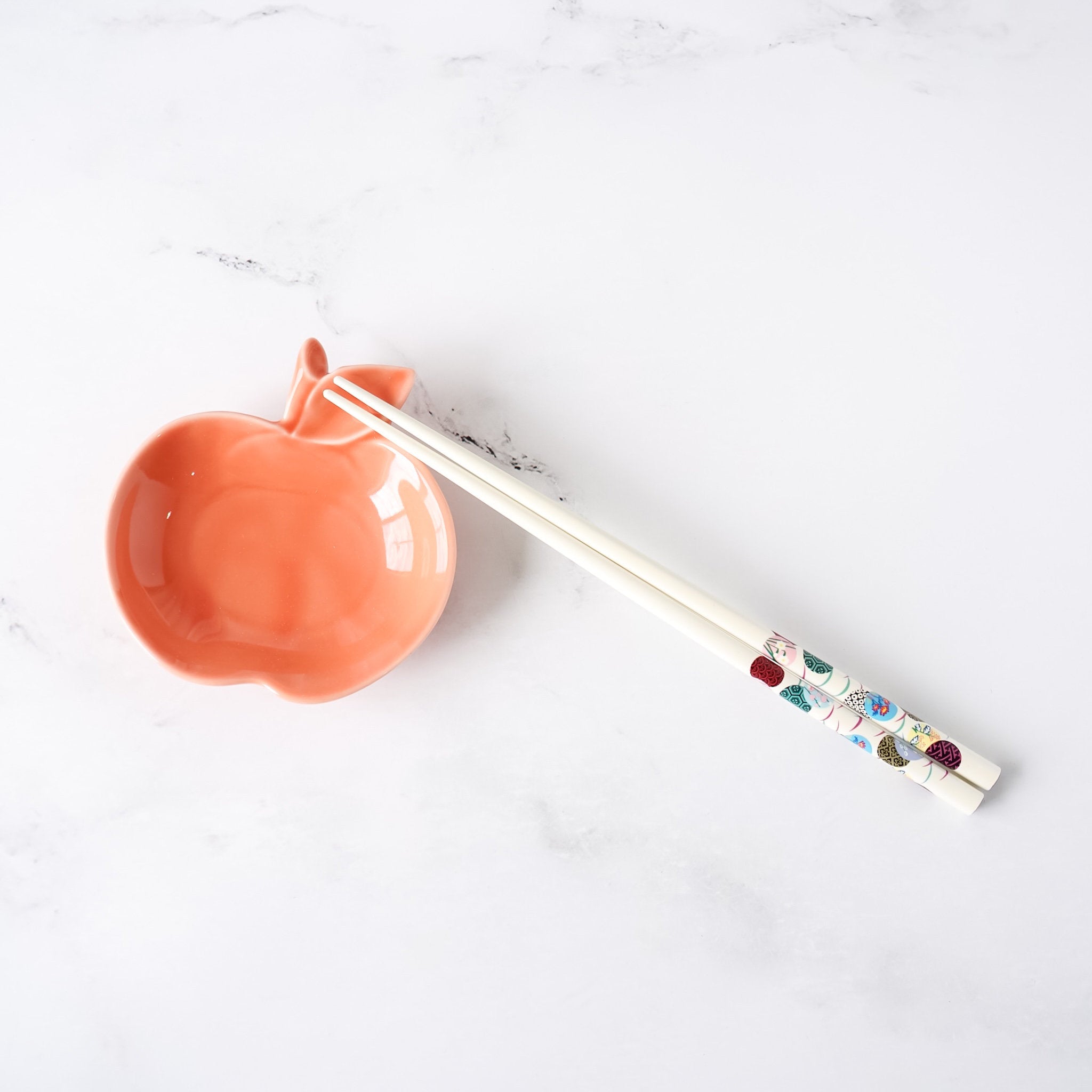 small apple side plate in coral, chopstick rest