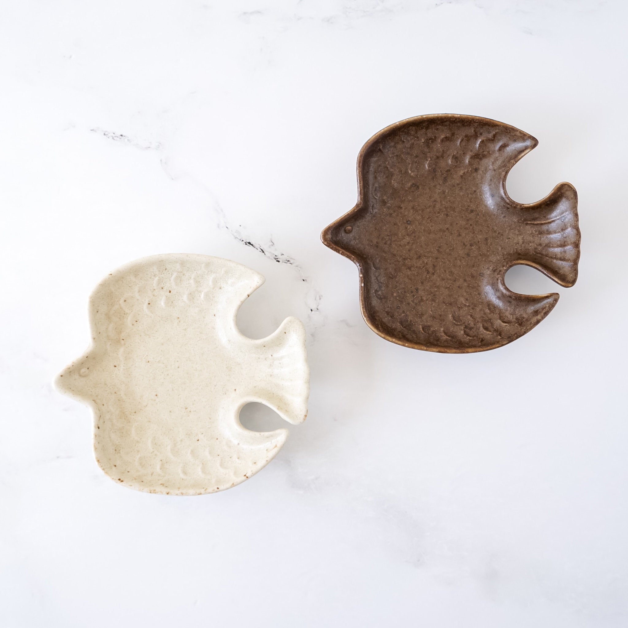 small bird plates in matte white, matte brown