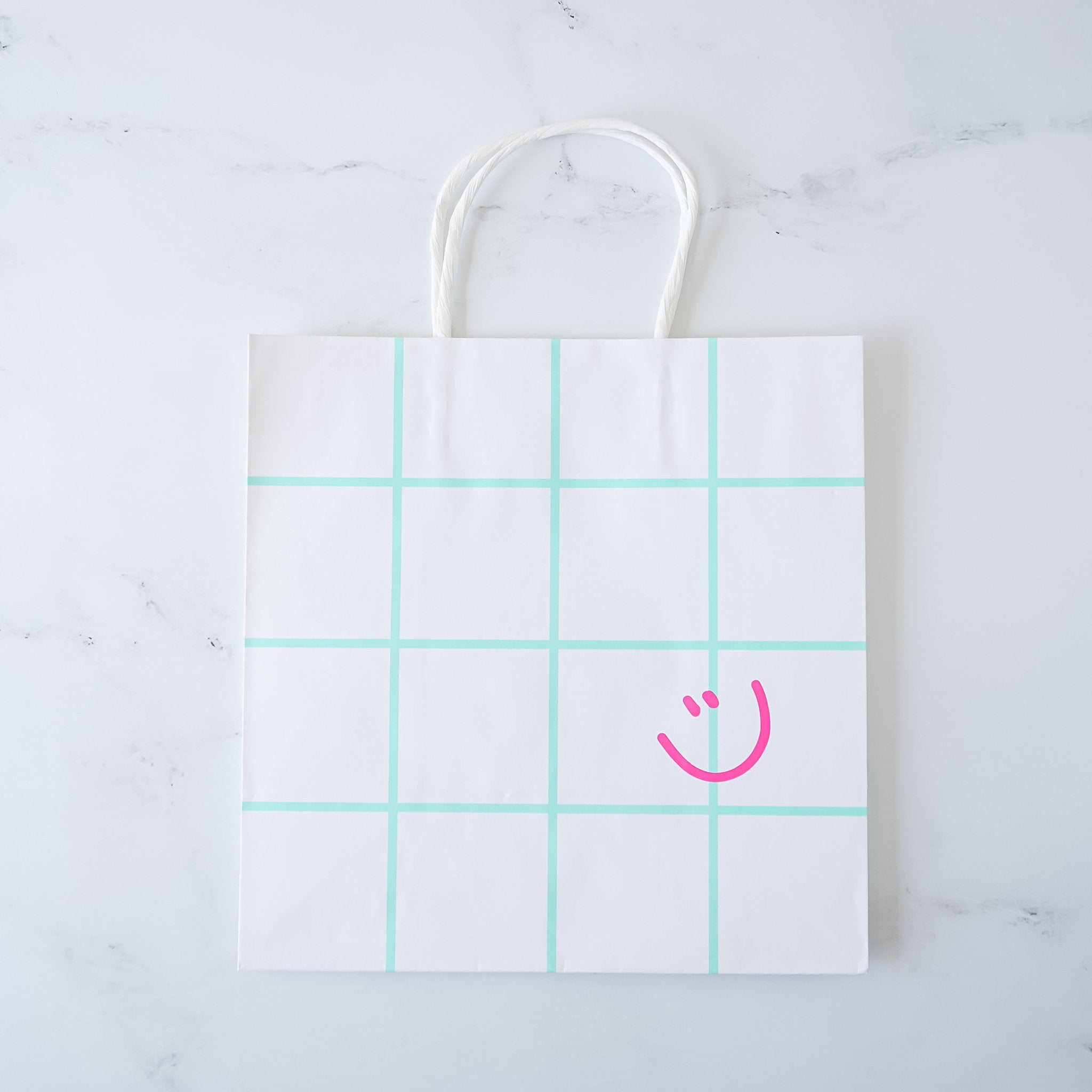 smiley face paper shopping bag in mint
