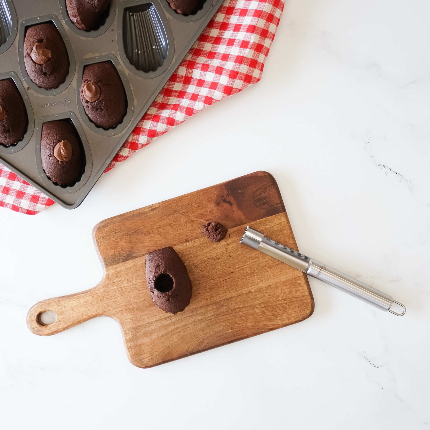 Madeleine with a cupcake corer