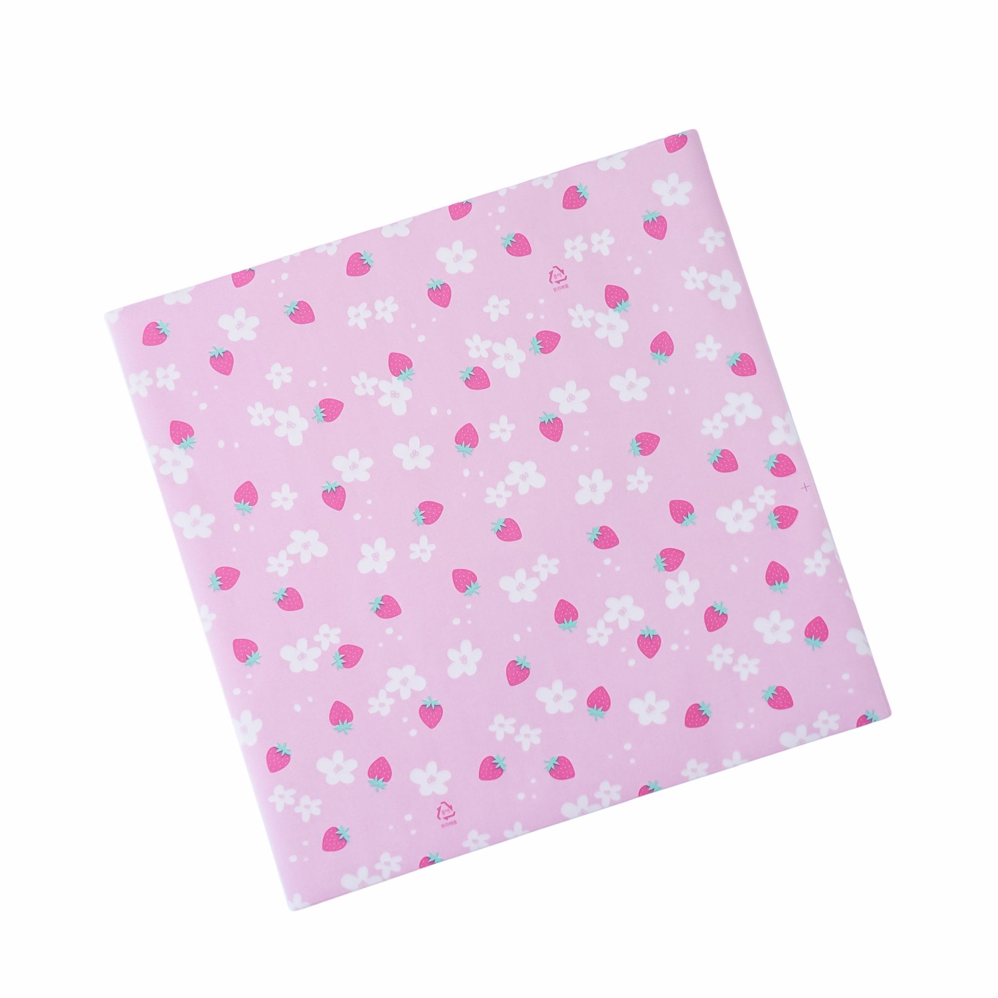A pre-cut sheet of pink deli paper with a pattern of strawberries and white flowers.