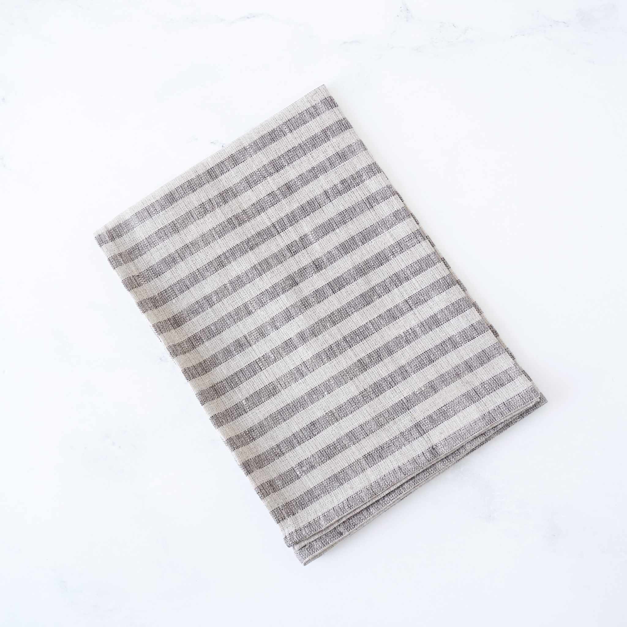 Striped linen fabric kitchen cloth on a white background