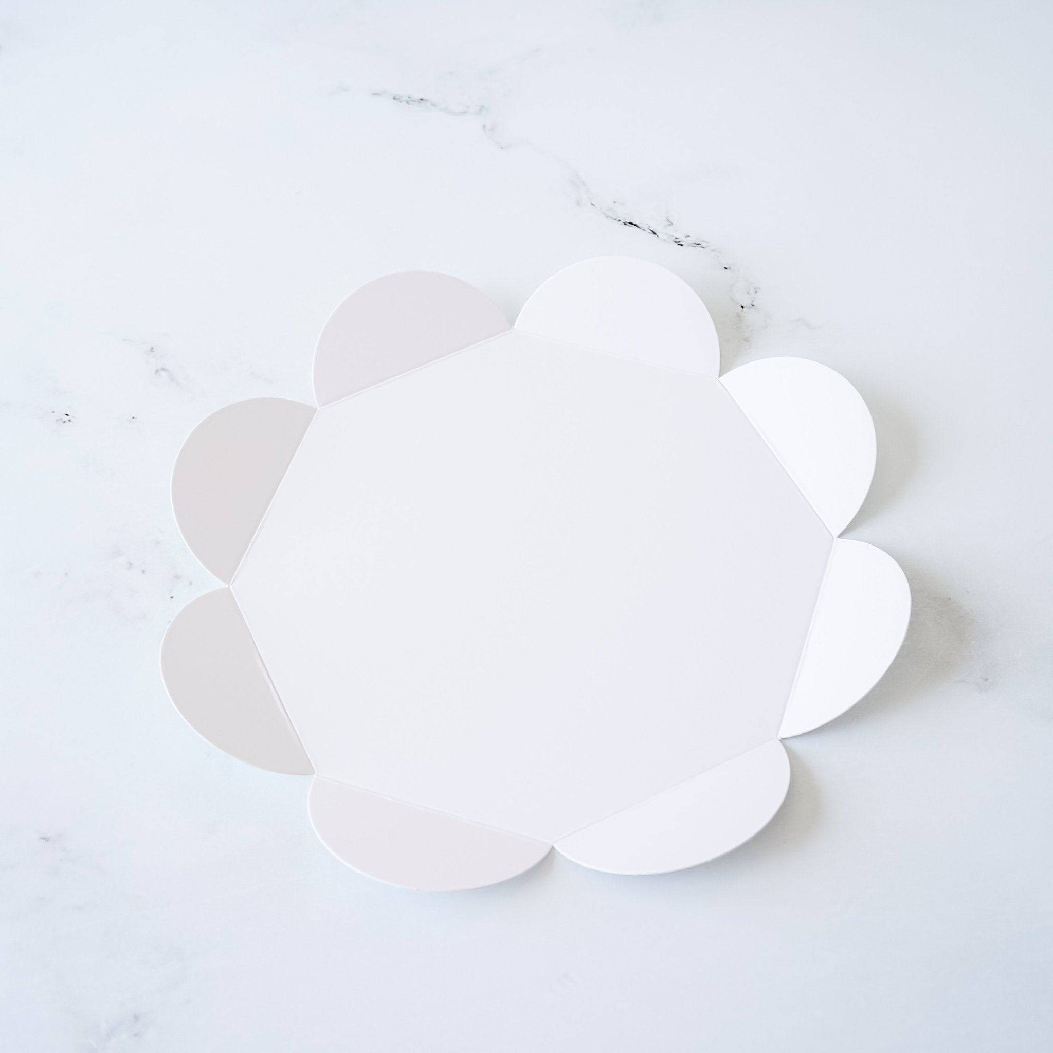 flower shaped cake board in white