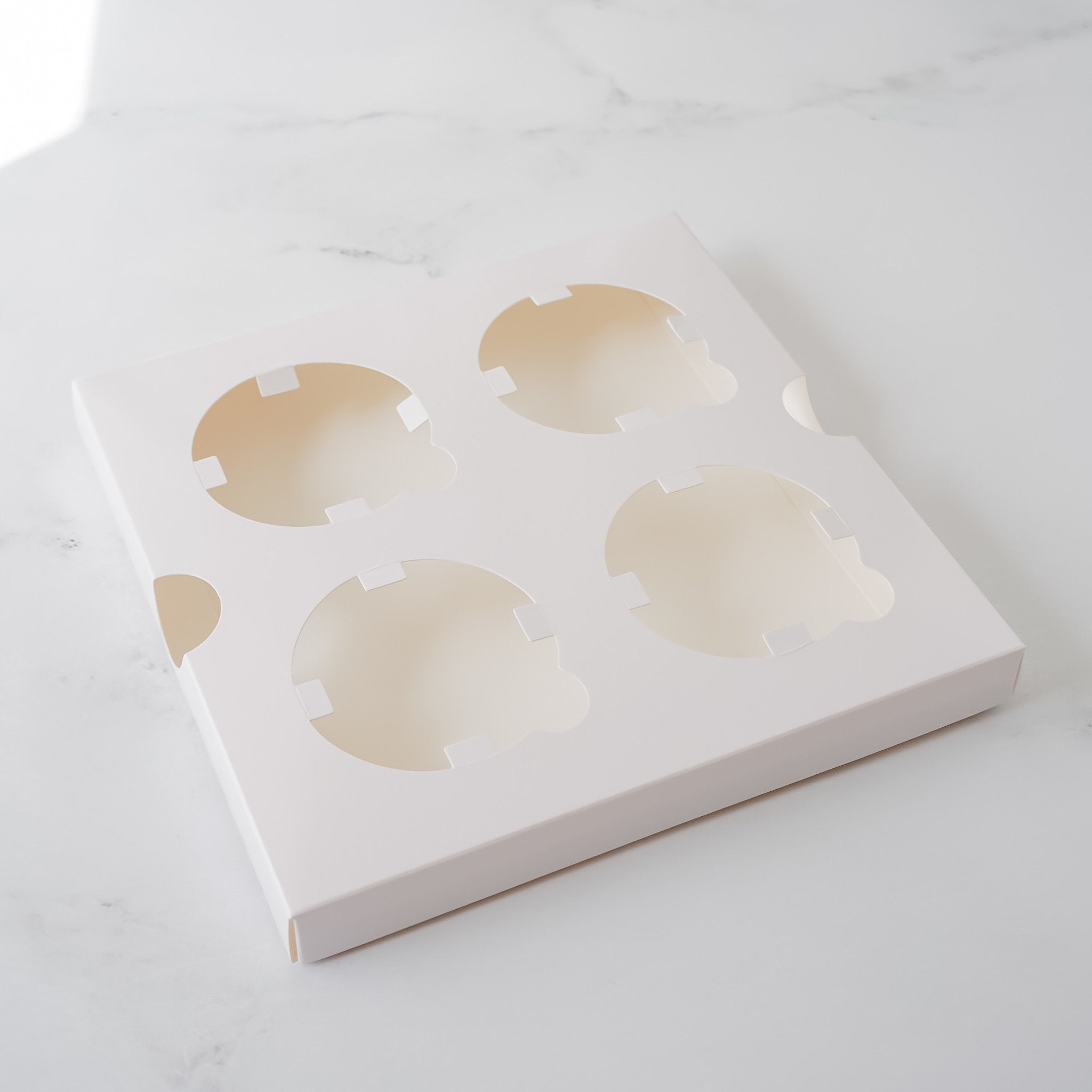 four cupcake holder in white