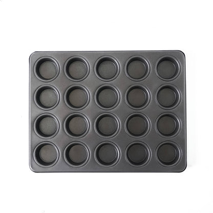 Black muffin tin with multiple compartments on a white background