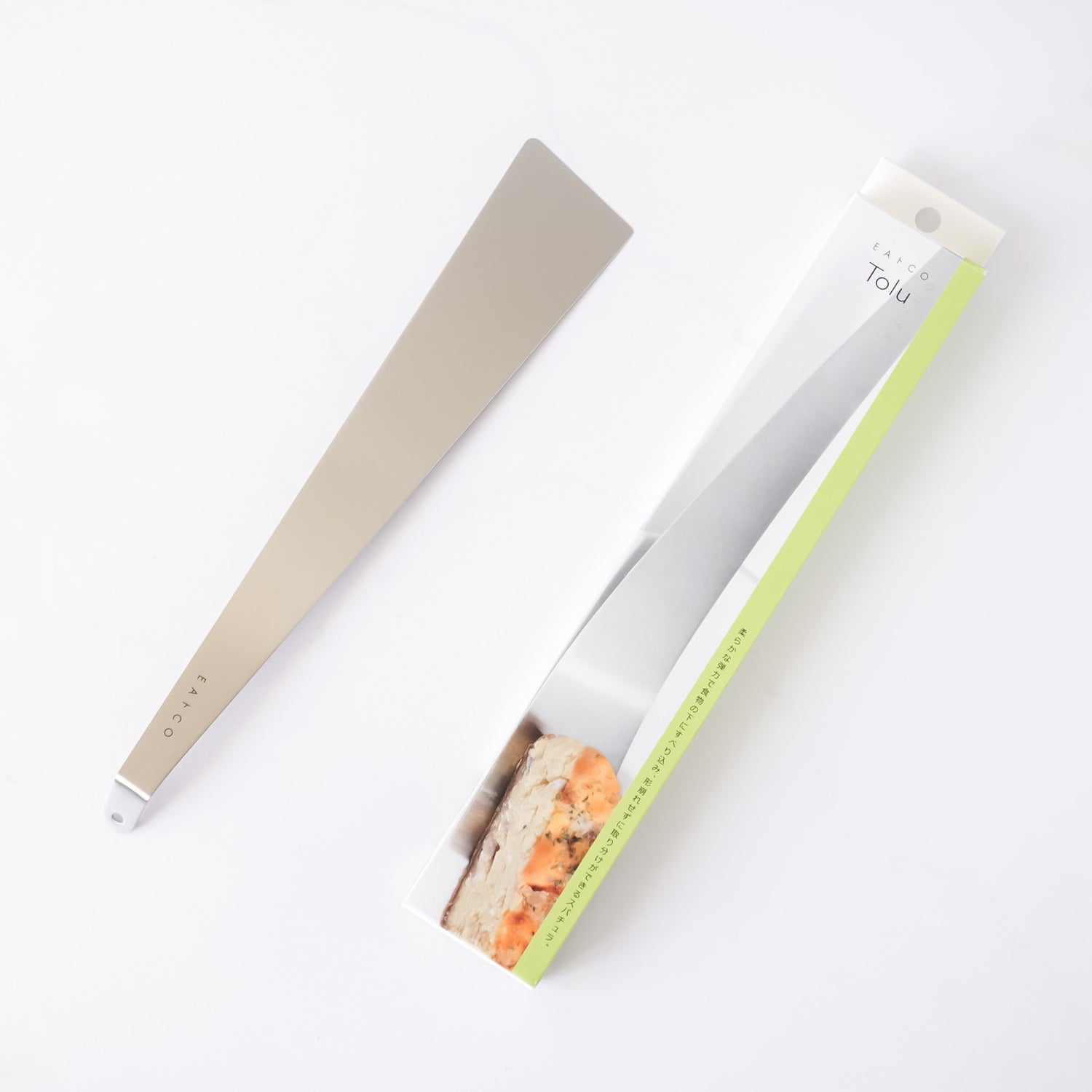Stainless steel spatula with a metallic handle on a white background