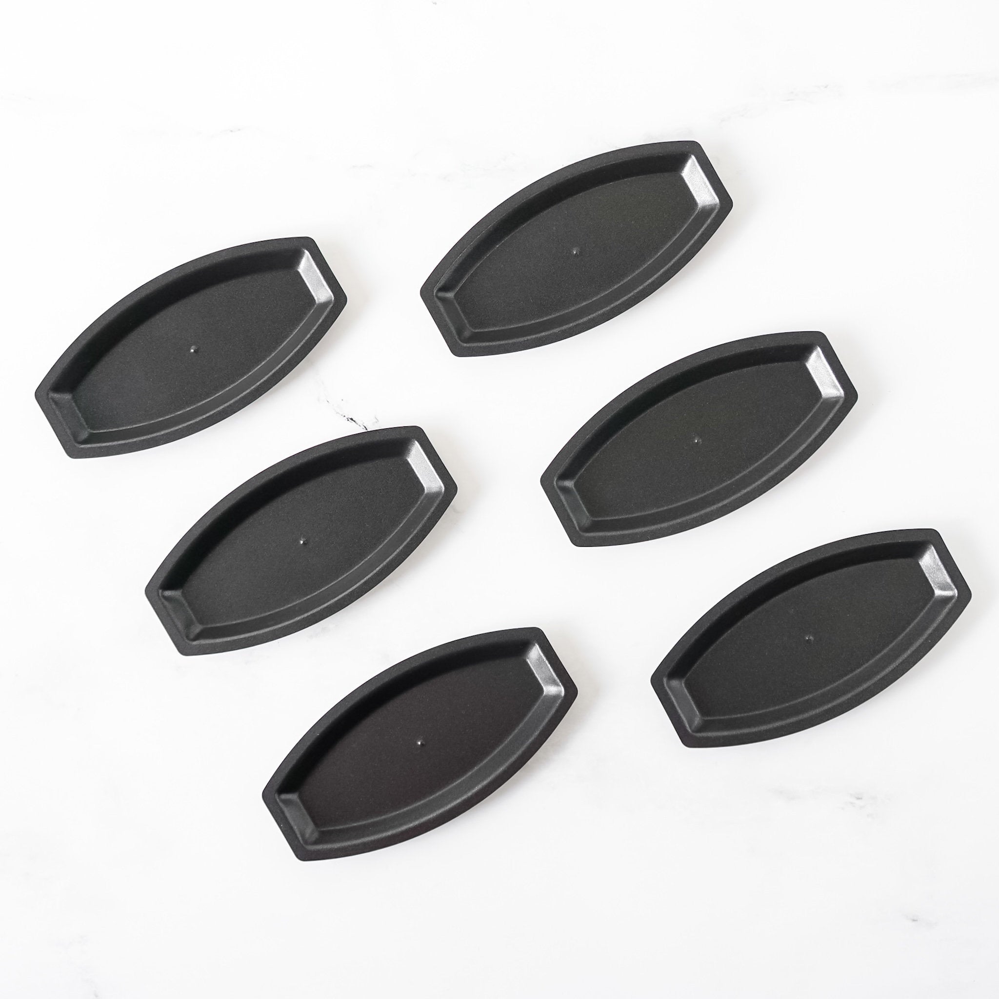 Set of six salt bread pans on a white background