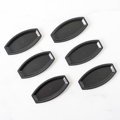 Set of six salt bread pans on a white background