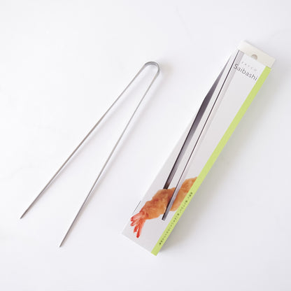 Metal tongs with packaging on a white background