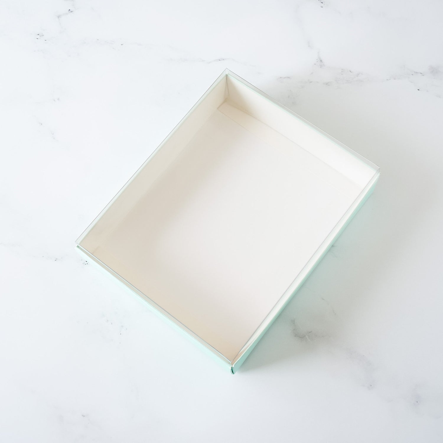bakery box with clear lid in mint green