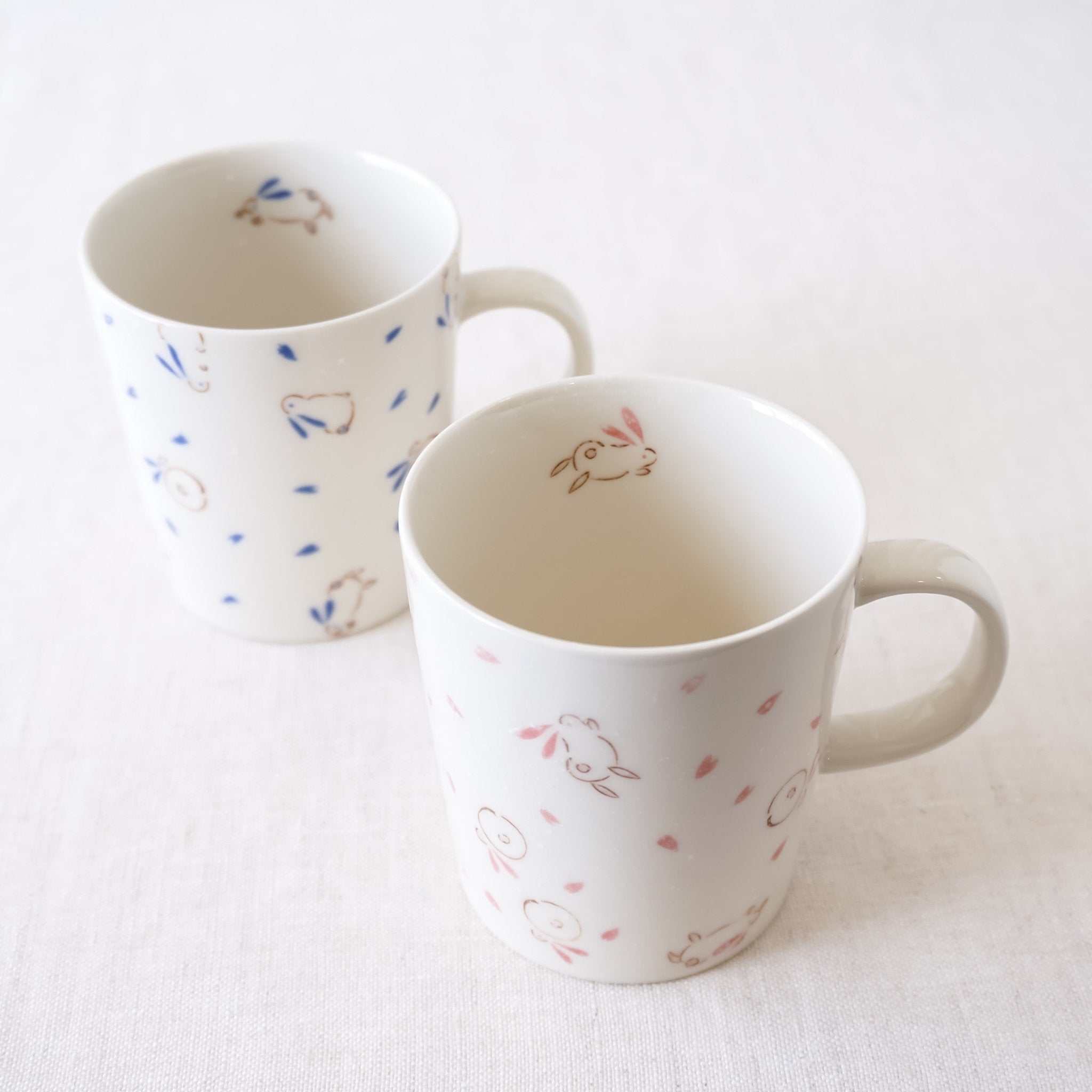 bouncing bunny coffee mugs in pink, blue