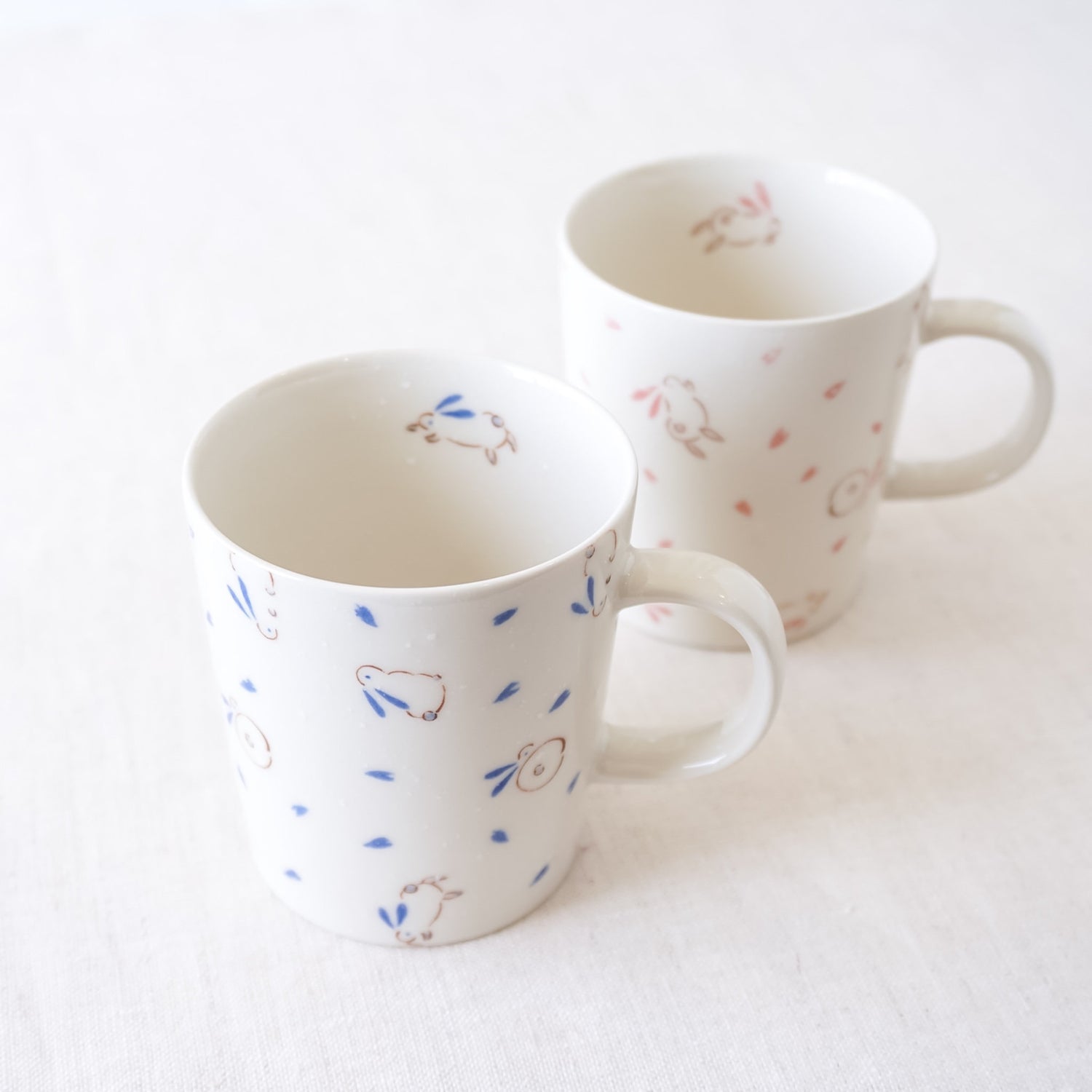 bouncing bunny mugs in pink, blue
