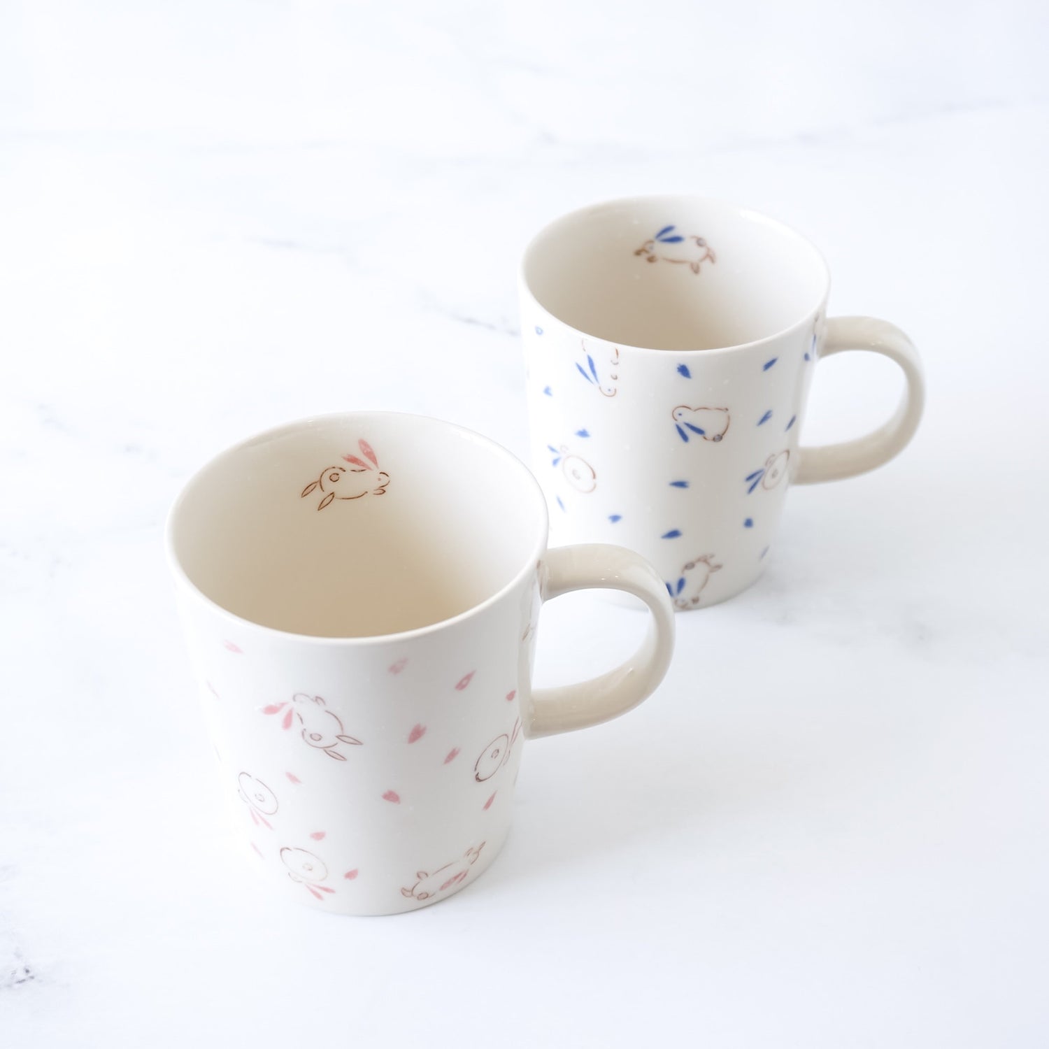 bouncing bunny porcelain mugs in blue and pink