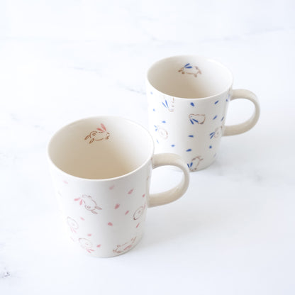 bouncing bunny porcelain mugs in blue and pink