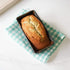 bread loaf pan on a dishcloth