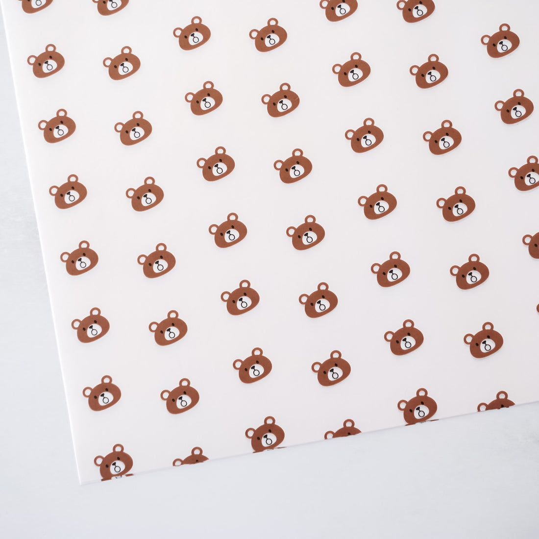 White deli paper with brown teddy bear pattern