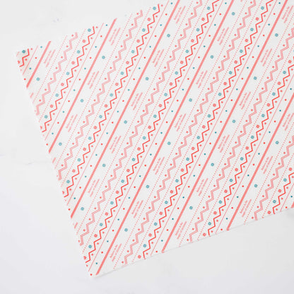  Sheets of deli paper with a festive red, green, and white Nordic print design, pre-cut for food service use.