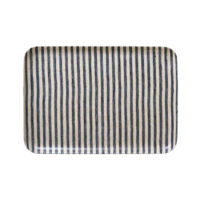 Rectangular tray with black and beige striped pattern on a white background