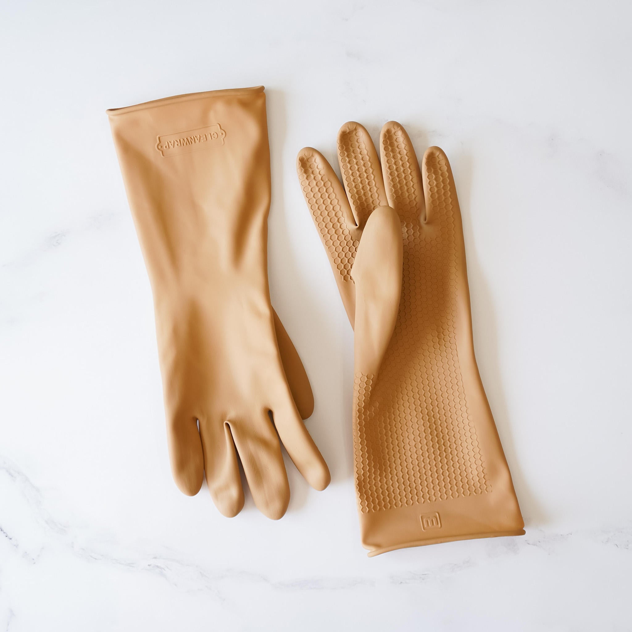 Two pairs of tan rubber dishwashing gloves with a honeycomb texture. The gloves have a logo on the wrist that says &
