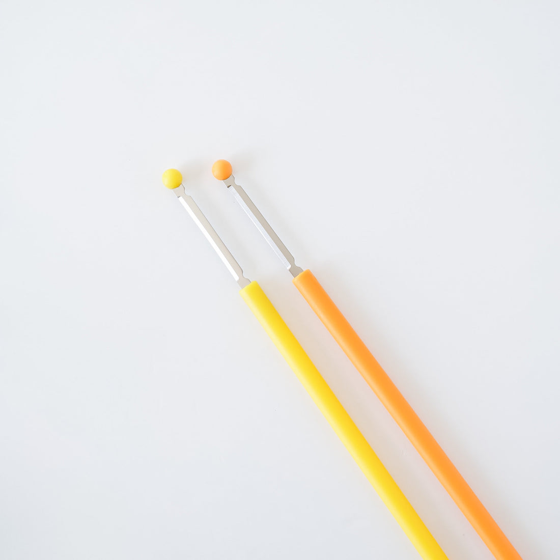 egg stirrer in yellow and orange