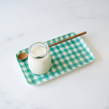 Panna cotta on a green check serving tray