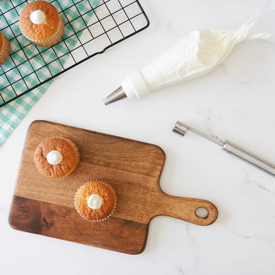 apple corer, cupcakes, and icing piping bag