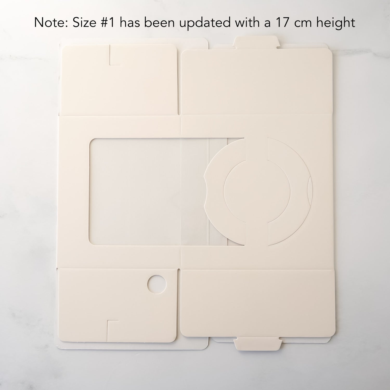 Ivory cake box with a clear window on a white background