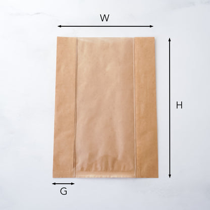 Brown paper bag with measurements labeled on a white background