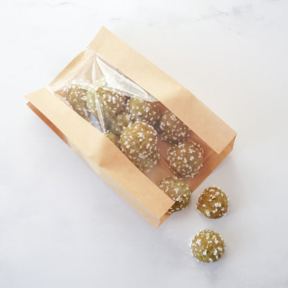 Packaged dessert balls with a clear window on a white background